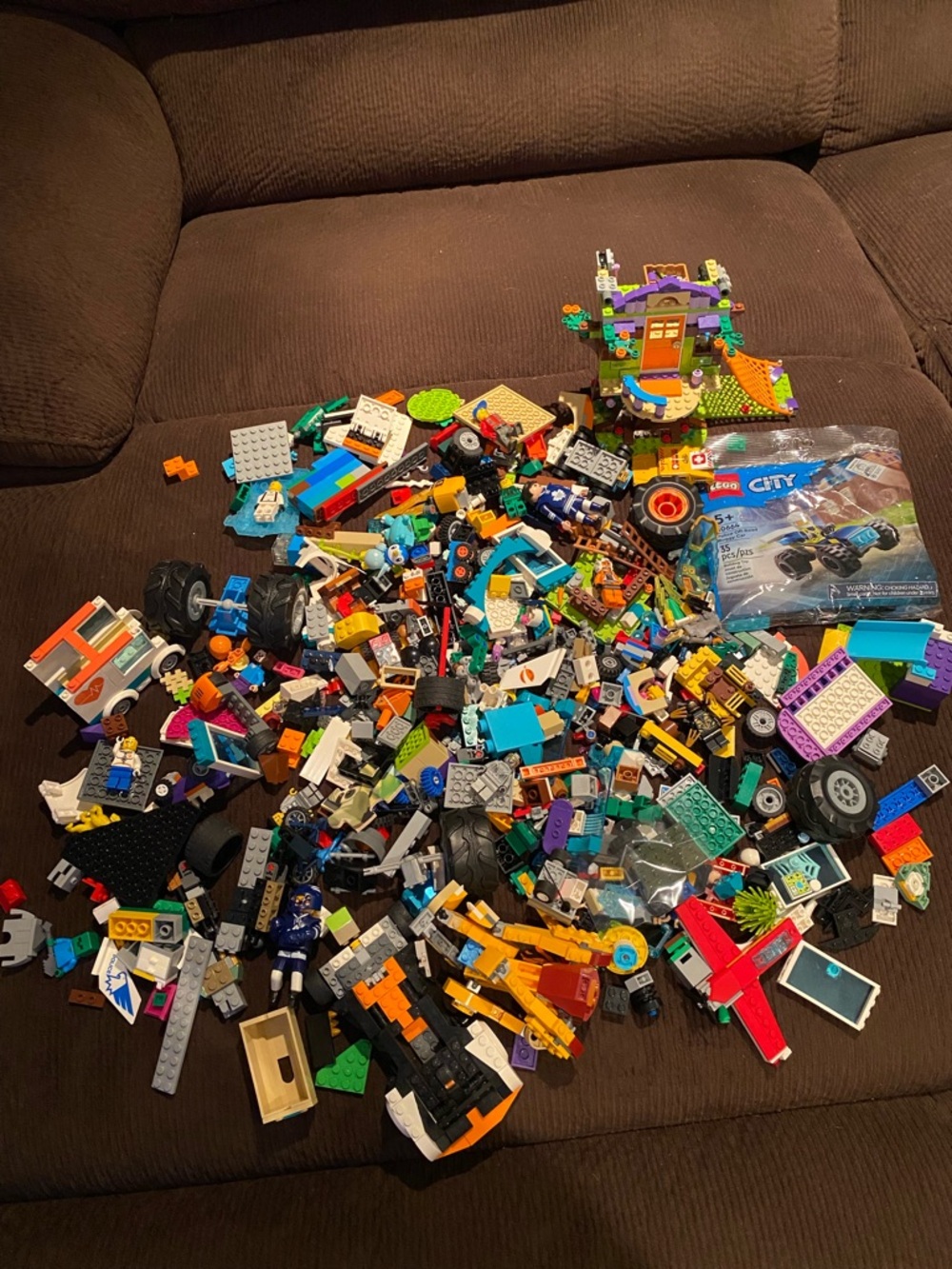 A box of Lego with Lego mini figures and (over 5 LBS) C